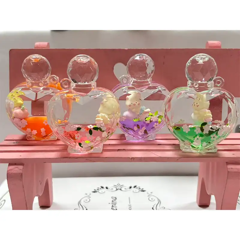 Botella de perfume en forma de corazón Llavero líquido